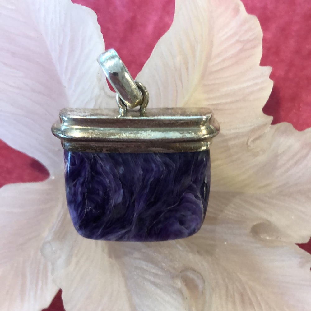 GE 925 amethyst pendant . One and 1/2 inches long and 1 inch wide